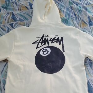 Stussy Off-White Hoodie with Black 8 Ball Design